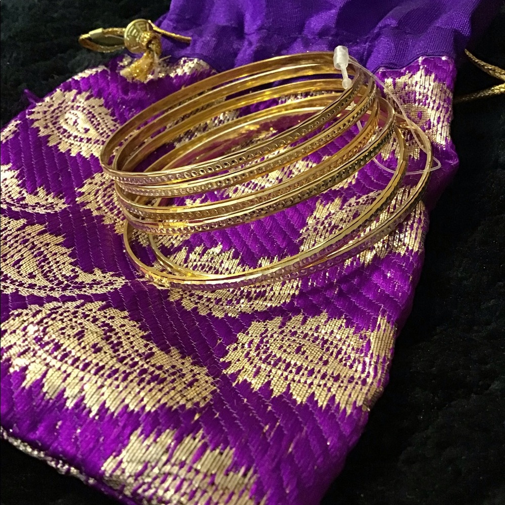 Gold bangle bracelets with decorative bag